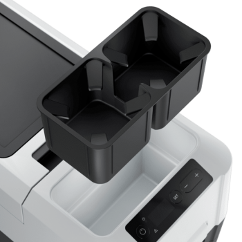 Le porte-gobelet peut être retiré pour accéder à un compartiment pour clés, câbles etc.